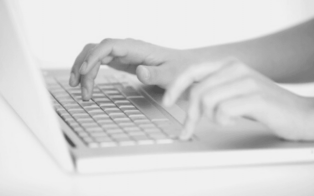 Featured Images - Typing Speed. Photo of two hands typing on a laptop. Image bought from DepositPhotos