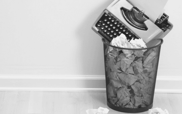 Featured Images - Typewritter in a waste basket full of paper