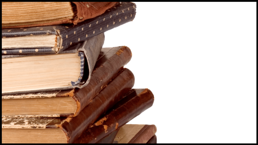 Photo of several old worn books with brown covers