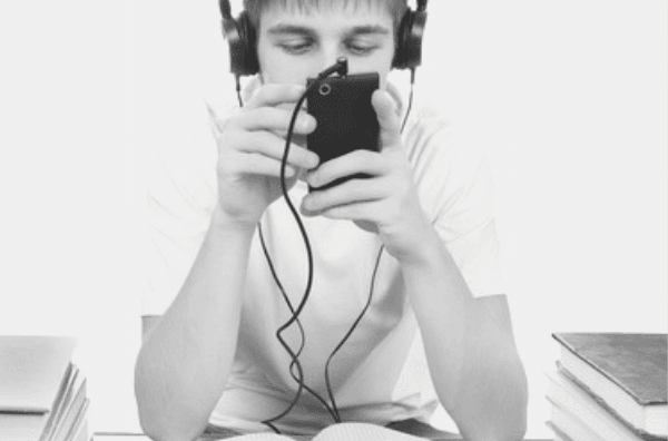 Featured Images - Man listening to music and playing on his phone