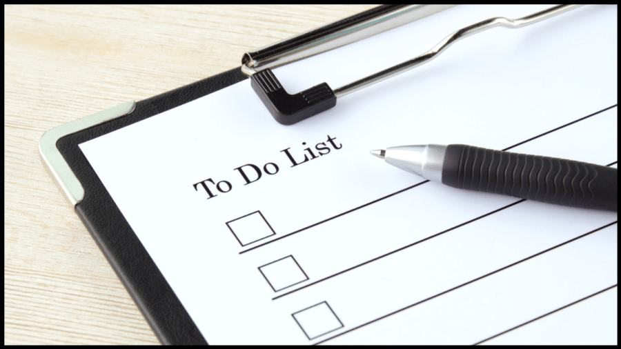 Close up photo of a clipboard with a To Do list checklist and pen.