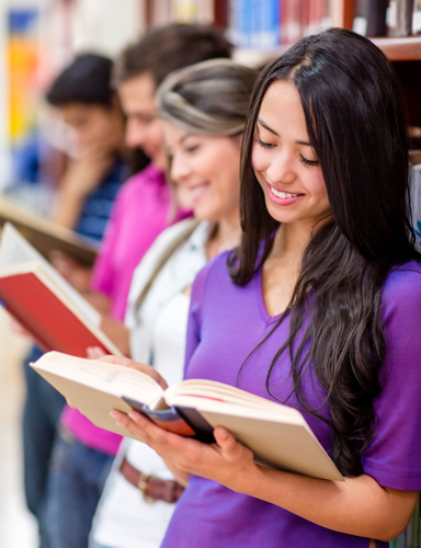 Image: Line of people in a library reading books