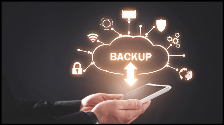 Image of a graphic of a cloud outline with the word Backup in the middle and an arrow going from a laptop. Text overlay reads How To avoid a meltdown: Back up your writing