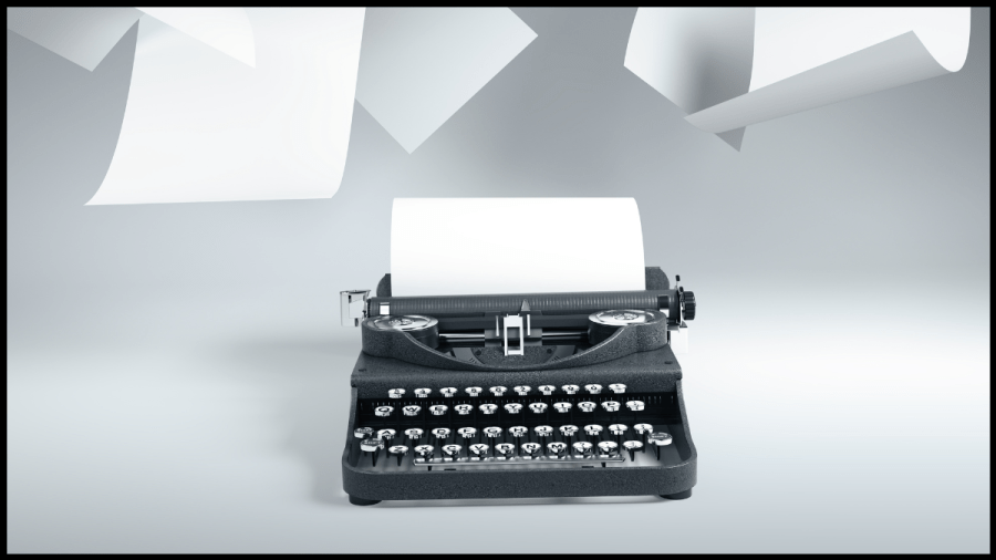 Photo of a typewriter with papers flying around above.