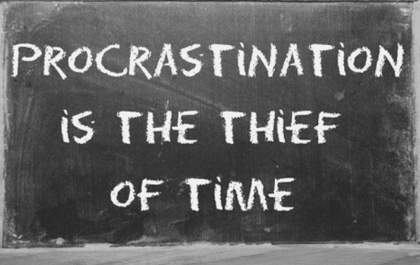 Featured Images - Chalkboard with the words "Procrastination is the thief of time" written on