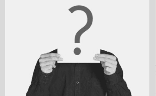 Featured Images - Man holding up a piece of paper in front of his face with a question mark on it.