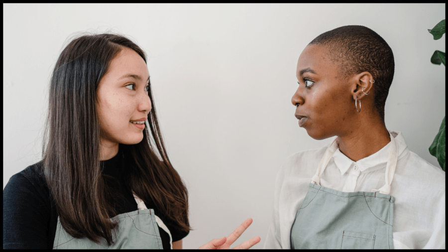 Photo of two young women talking