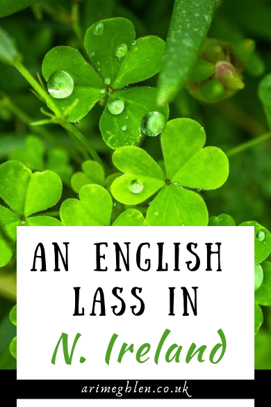 Close up photo of bright green 3-leaf clovers. Text overlay reads An English Lass in N, ireland