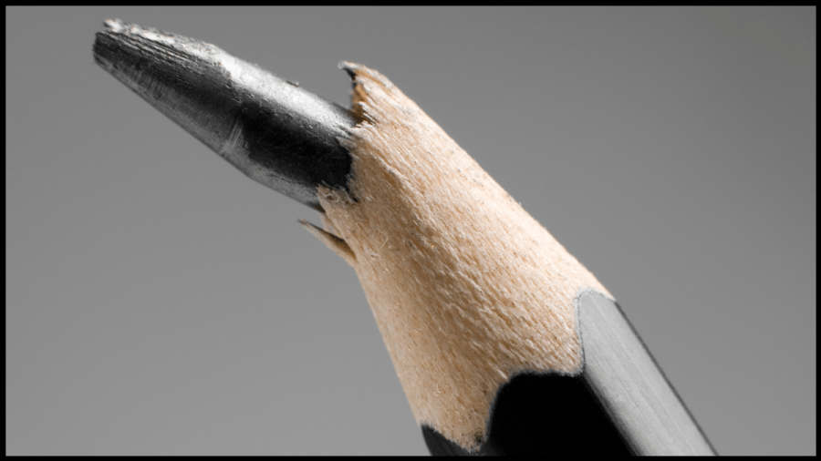 Close up photo of a black pencil with a broken lead