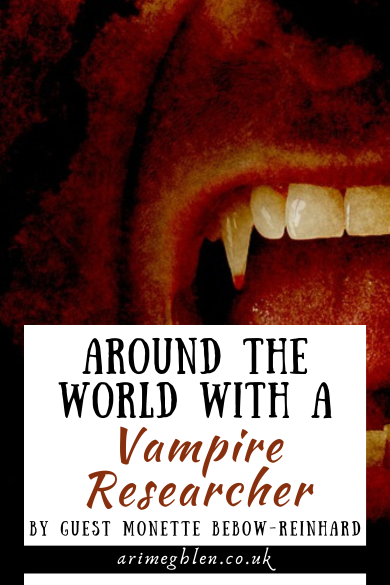 Close up of a mouth, lips open showing vampire fangs. Text overlay reads Around the world with a Vampire Researcher by guest Monette Bebow-Reinhard. AriMeghlen.co.uk