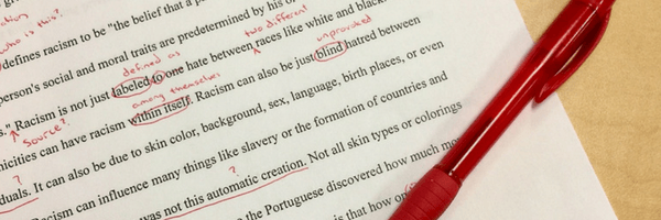 Page of edits, red pen scribbles. Title Image for Editing Page