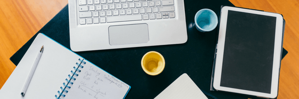 TitleImage- Desk with laptop, tablet and pads