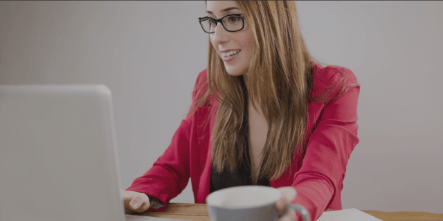 Photo of woman working on laptop