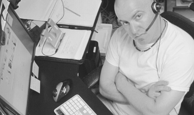 Featured Images - Man sat before a computer wearing a headset. Image from Pixabay