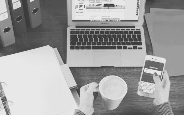 Featured Images - Personal working on a laptop and phone. Image from Pixabay