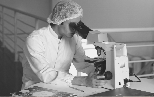 Featured Image for Biochemist article. scientist looking through a microscope. Image from pixabay
