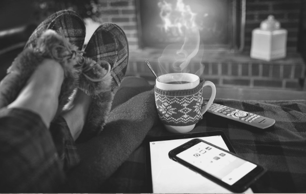 Featured Image. Slippered feet restng before a fire, cup of hot chocolate. Image from Pixabay