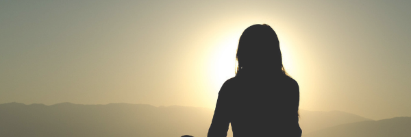 Quiet head space. Silhouette of a woman in the sunset. Image from Pixabay