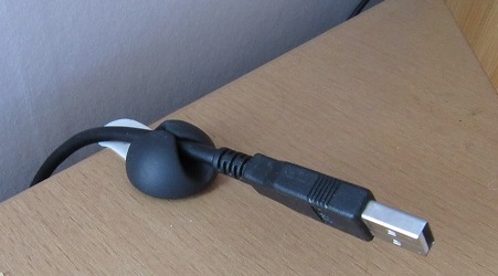 Photo of rubber workstation cable holder for Printer cable
