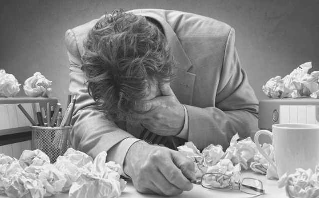 Featured Images - HAting your writing - Man surrounded by paper, head in his hands