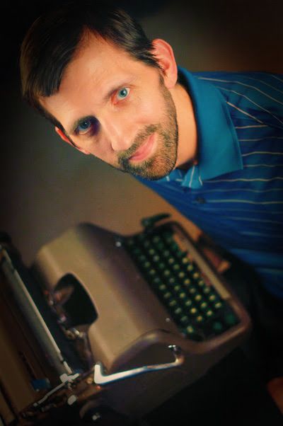 Headshot of Writer A.S McDermott with typewriter in the background