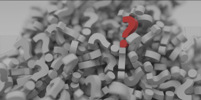 Blog Image - a pile of white question marks with a single red question mark on top