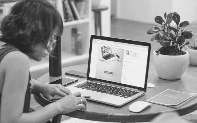 Featured Images - Woman working on a laptop blogging