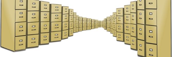 A photo of dozens of four-drawer filing cabinets. Image from Pixabay