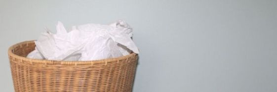 Photo of top of waste paper basket, full of discarded papers. Image from Pixabay