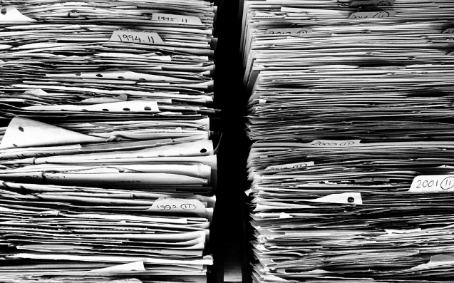 Featured Images - Black and white photo of two large stacks of paper. Image from Pixabay
