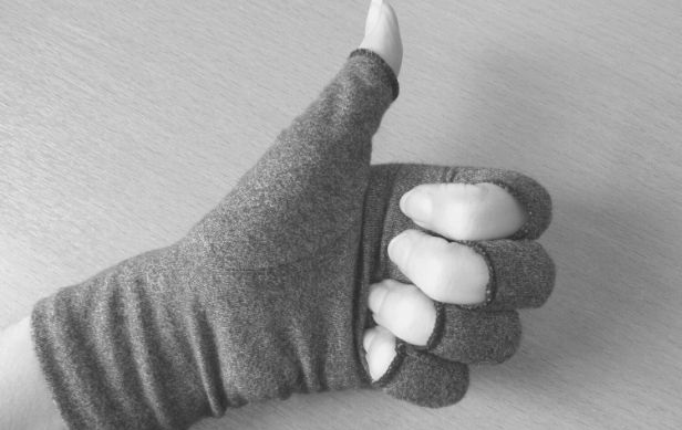 Featured Images - Grey compression gloves on a hand in thumbs up