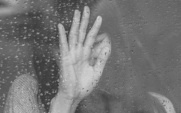 Featured Images - Woman resting her hand against a rain covered window. Image from Pixabay