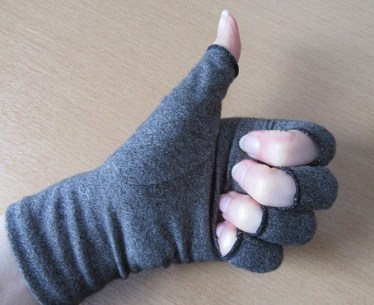 Photo of hand in thumbs up wearing a Duerer Compression Glove