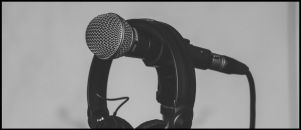 Podcast Page: Image of a microphone and headphones