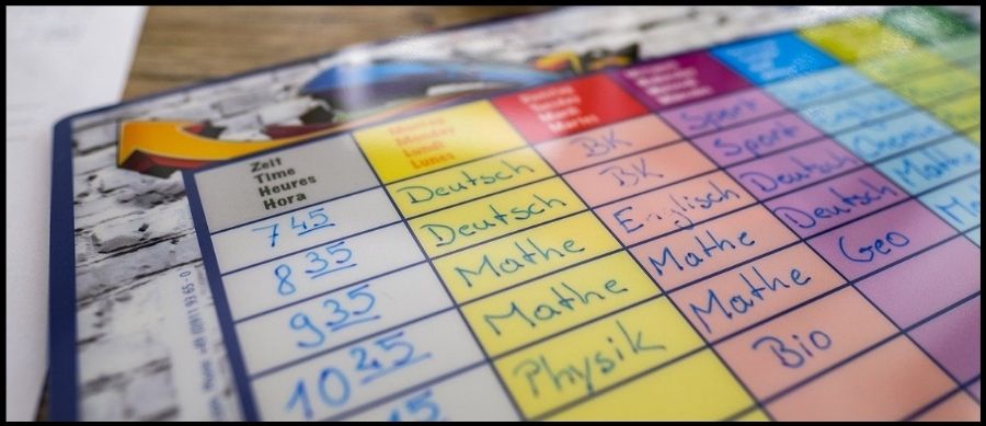 Close up photo of a colour coded time table