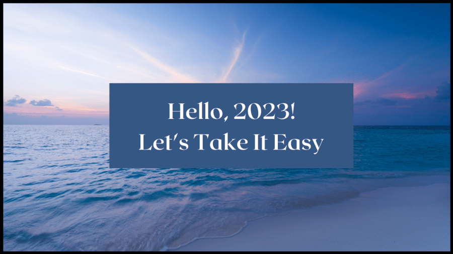 Image of a blue sky and ocean with slice of beach. Text overlay reads Hello 2023, Let's take it easy