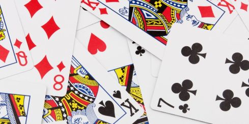 Photo of a pile of playing cards all spread out. Image from Canva Pro