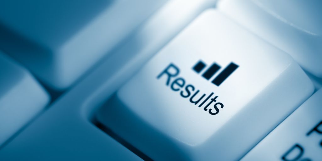 Photo of a computer keyboard key with the word "results" on the key along with a bar chart. Image from Canva