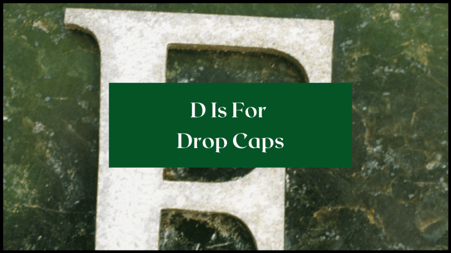 Large white E on a green marble background. Text overlay reads D is for Drop Caps.